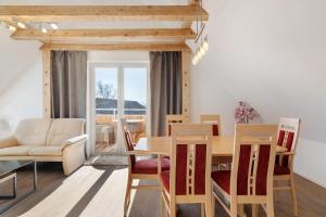 a dining room with a table and chairs at Caroline Magg in Lindau