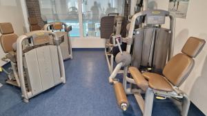 a row of exercise equipment in a gym at Bayerwaldresort in Sankt Englmar