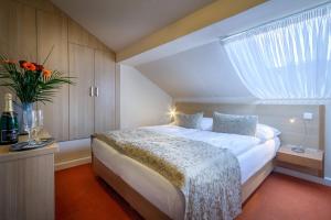 Cama o camas de una habitación en Hotel Taurus