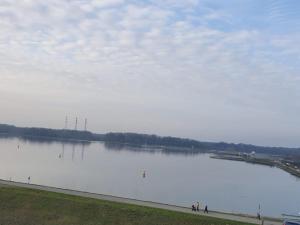 a large body of water with people walking around it at Haus48 in Neuried