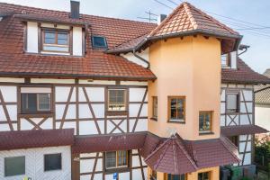 a house with brown roofs at Haus48 in Neuried
