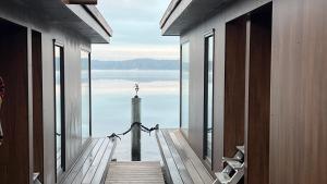 a view of the ocean from a room with windows at Tiny House Nr 2 in Schwielowsee