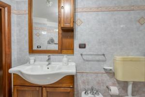 a bathroom with a sink and a toilet at Meraviglie Salentine - Lecce in Lequile