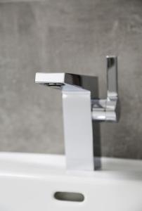 a silver sink in a bathroom with at Ferienwohnungen Joachim Fischer in Gündelbach +13 photos