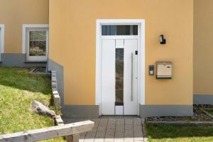 a white door on the side of a house at Fewo Furtwangen in Furtwangen