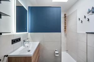 a bathroom with a sink and a shower at Ferienbungalow Süssau in Süssau +19 photos