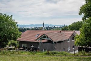 a large building with a church in the background at Ferienhof Mrowka in Reutin