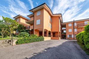 an apartment building with a driveway at My town home apartment in Torri del Benaco