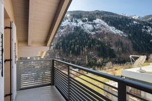 a balcony with a view of a mountain at Cà Dei Nane Vermiglio in Vermiglio