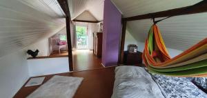 a room with a bed with a hammock in it at Ferienhaus am Wald in Reichshof 
