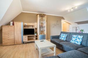 a living room with a couch and a table at Haus48 in Neuried +33 photos