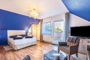 a bedroom with a bed and a large window at Ferienwohnung im Ländlichen Raum in Reuthen