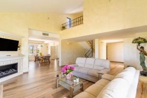 a living room with a couch and a fireplace at Casa Vacanze Le Giuggiole in Spongano