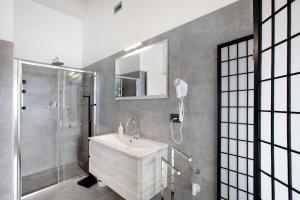 a bathroom with a sink and a shower at Residence soleluna - Loft Sirio in Roisan +21 photos