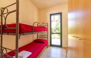 a room with two bunk beds and a door at Lilybeo Village - Camping & Residence in Marsala +28 photos