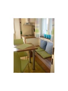 a living room with a table and a couch at Haus Schnitzler in Wasserburg