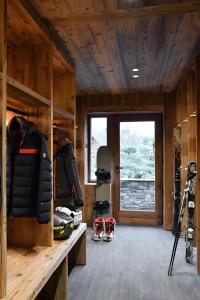 a room with skis and ski equipment in a cabin at Chalet Enigma in La Clusaz
