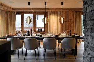 a dining room with a table and chairs at Chalet Enigma in La Clusaz
