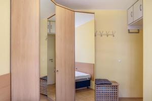 a room with a mirror and a bed in a room at Ferienwohnung Tannenblick 1-3 in Oberhof
