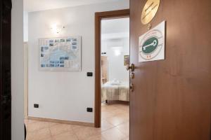 a door to a room with a map on the wall at Affittacamere Monica in Levanto +81 photos