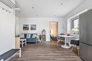 a living room with a couch and a table at Mika in Oesterdeichstrich