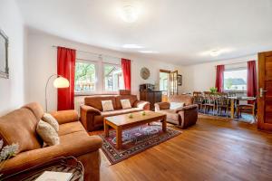 a living room with a couch and a table at Domäne Bollinger Morbach in Morbach