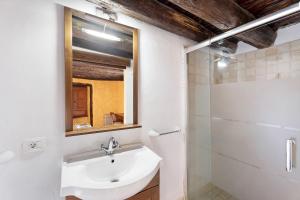 a bathroom with a sink and a mirror at El Lagar in Frontera +17 photos