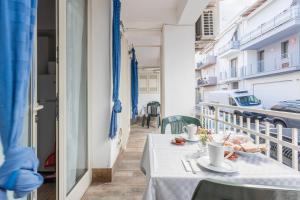 a table on the balcony of a building at Casavacanzefranca - 12 in Terrasini +14 photos