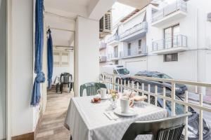 a table on the balcony of a building at Casavacanzefranca - 12 in Terrasini