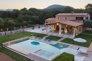 an aerial view of a house with a swimming pool at Villa Golf Marina Premium in Pollença