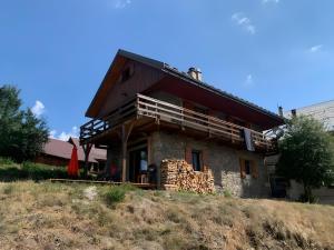 a house sitting on top of a hill at Gite Le Mazot in Albiez-Montrond