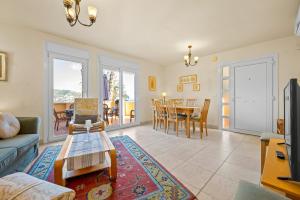 a living room with a couch and a table at Villa Fuentes in Almuñécar