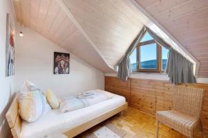 a room with a bed and a window at Ferienwohnung Panoramablick in Lenzkirch
