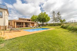 a house with a swimming pool in a yard at Casa ponet in Solsona