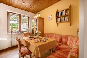 a living room with a table and a couch at Casa Mia in Bad Dürkheim