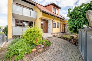 a house with a walkway in front of it at Casa Mia in Bad Dürkheim