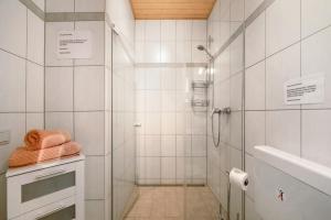 a white bathroom with a shower and a sink at Casa Mia in Bad Dürkheim +16 photos