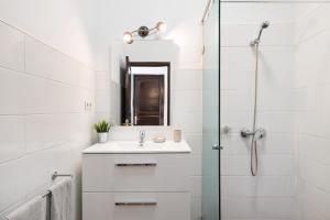 a white bathroom with a sink and a shower at Casa Los Angeles in Tías +16 photos