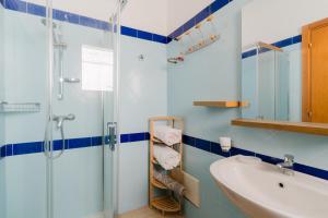 a bathroom with a shower and a sink at Residence Punta Pizzo in Marina di Mancaversa +43 photos