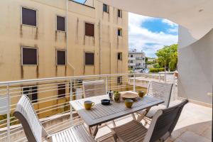 a table and chairs on the balcony of a building at Casa Vacanza Susanna in Otranto