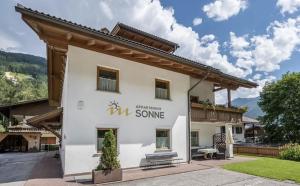 a white building with the words remember some on it at App Sonne Nr 14 in Lutago +3 photos