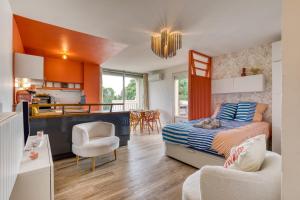 a small bedroom with a bed and a kitchen at Sunny Day in La Grande Motte +30 photos