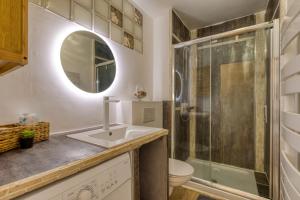 a bathroom with a sink and a shower at Sunny Day in La Grande Motte