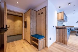 a room with a wooden closet with a bench in it at Ladinser Hof Sternenhimmel in Castelrotto