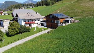 an aerial view of a house on a hill at Ladinser Hof Sternenhimmel in Castelrotto