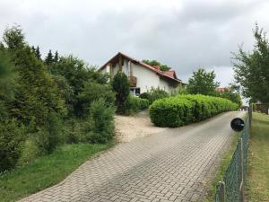 a brick road in front of a house at Im schönen Garten in Haldensleben