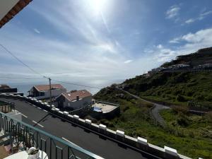 a view of a hill with a road and houses at Casa do Pico in Ribeira Brava +32 photos