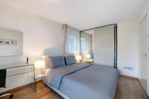 a bedroom with a bed and a television in it at Apartement Panoramaresidence in Avelengo