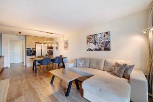 a living room with a couch and a table at Apartement Panoramaresidence in Avelengo