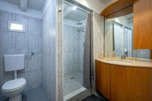 a bathroom with a toilet and a sink and a shower at Oasi Torre Di Mastro, Conversano in Conversano +21 photos